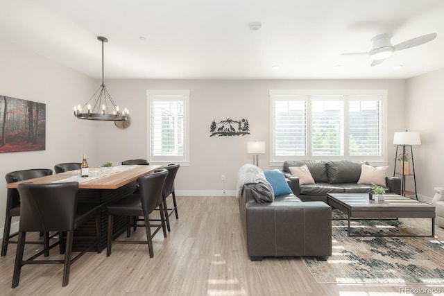 400 Baker Dr Unit Te103, Winter Park, CO 80482 - dining space with light wood-style flooring, a chandelier, and a ceiling fan