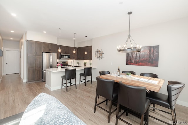 400 Baker Dr Unit Te103, Winter Park, CO 80482 - dining room with a chandelier, light wood-type flooring, and recessed lighting