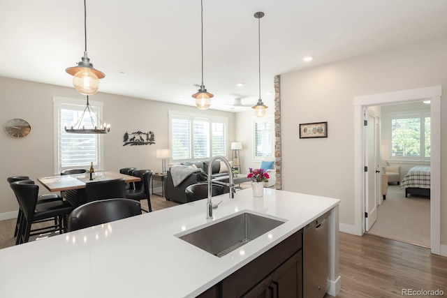 400 Baker Dr Unit Te103, Winter Park, CO 80482 - kitchen with stainless steel dishwasher, plenty of natural light, wood finished floors, light countertops, and recessed lighting