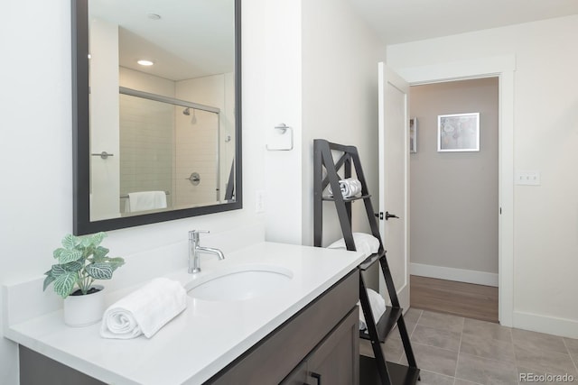 400 Baker Dr Unit Te103, Winter Park, CO 80482 - full bath featuring vanity, tile patterned floors, a tile shower, and recessed lighting
