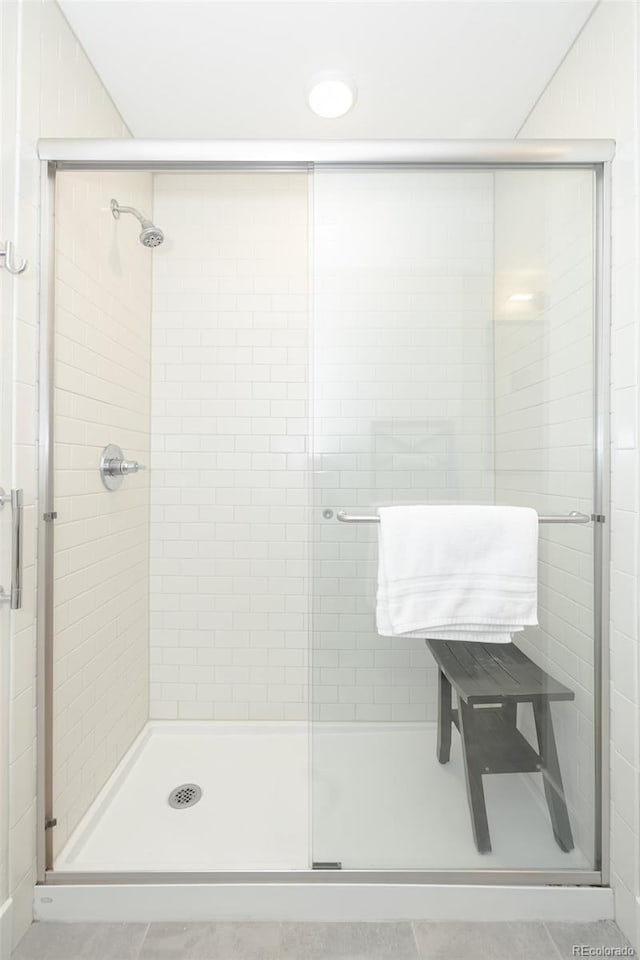 400 Baker Dr Unit Te103, Winter Park, CO 80482 - full bathroom featuring a shower stall and tile patterned floors