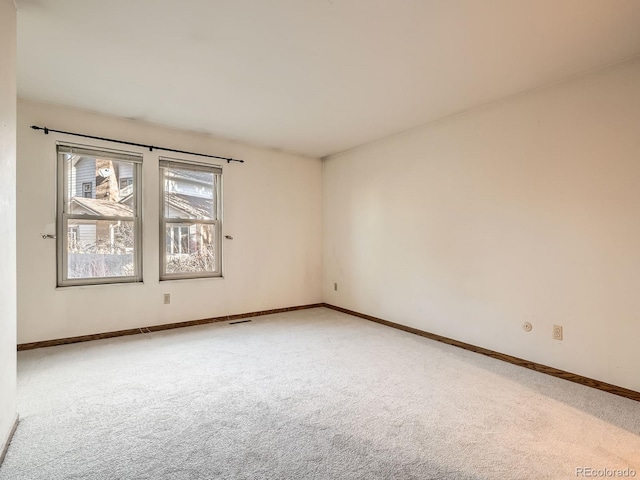 spare room featuring carpet flooring