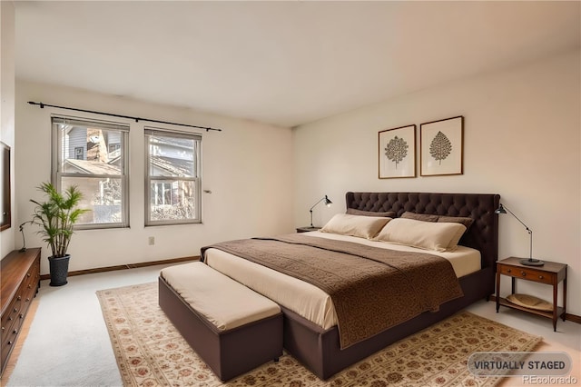 bedroom featuring carpet flooring and baseboards