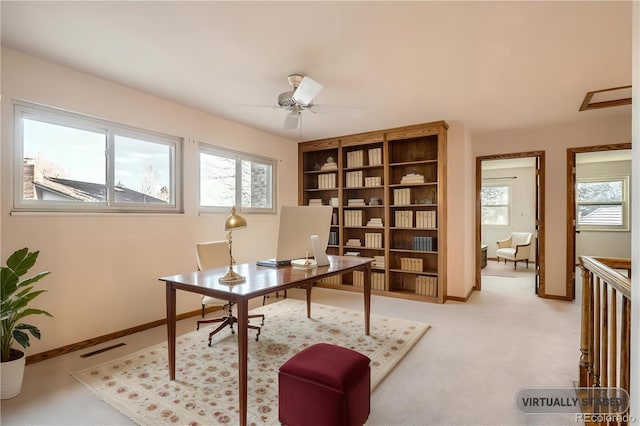 office area with plenty of natural light, baseboards, and a ceiling fan