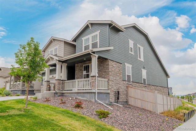 17471 Gandy Dancer Ln, Parker, CO 80134 - view of front of property featuring stone siding, covered porch, and a front yard