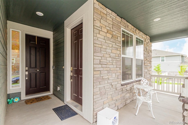 17471 Gandy Dancer Ln, Parker, CO 80134 - view of exterior entry with a porch and stone siding