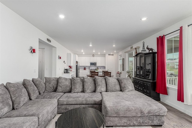 17471 Gandy Dancer Ln, Parker, CO 80134 - living area featuring light wood-style floors and recessed lighting