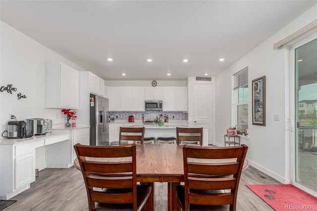 17471 Gandy Dancer Ln, Parker, CO 80134 - dining room featuring light wood finished floors and recessed lighting
