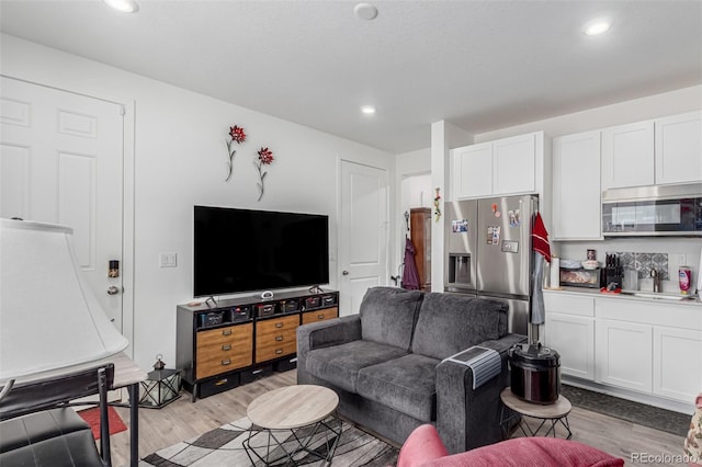 17471 Gandy Dancer Ln, Parker, CO 80134 - living area with light wood-style floors and recessed lighting