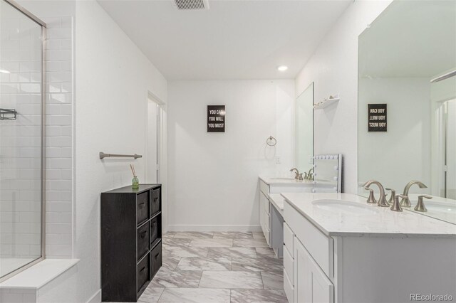 17471 Gandy Dancer Ln, Parker, CO 80134 - full bath featuring double vanity, marble finish floors, recessed lighting, and tiled shower