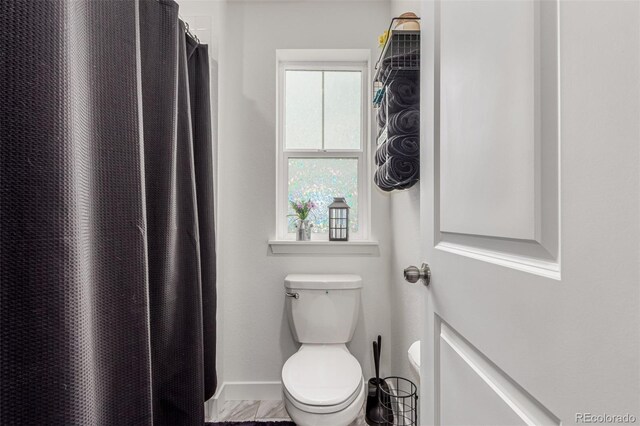 17471 Gandy Dancer Ln, Parker, CO 80134 - bathroom with toilet and a shower with curtain
