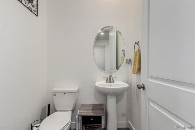 17471 Gandy Dancer Ln, Parker, CO 80134 - bathroom with toilet and baseboards