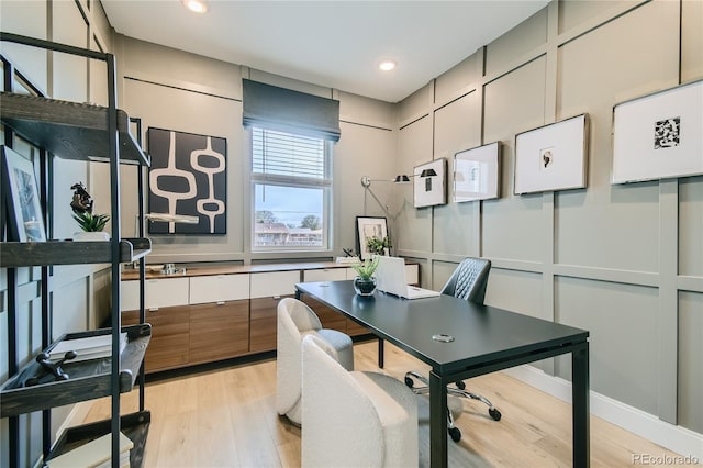 6864 Bryant Ct, Denver, CO 80221 - home office with light wood finished floors and recessed lighting