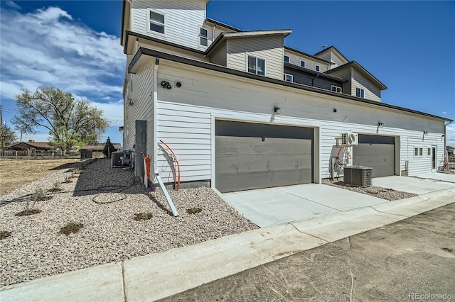 6864 Bryant Ct, Denver, CO 80221 - view of property exterior with driveway and central air condition unit