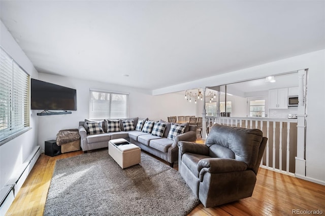 living room featuring light hardwood / wood-style flooring and baseboard heating