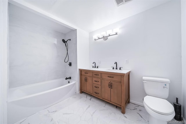 full bathroom featuring tiled shower / bath, vanity, and toilet