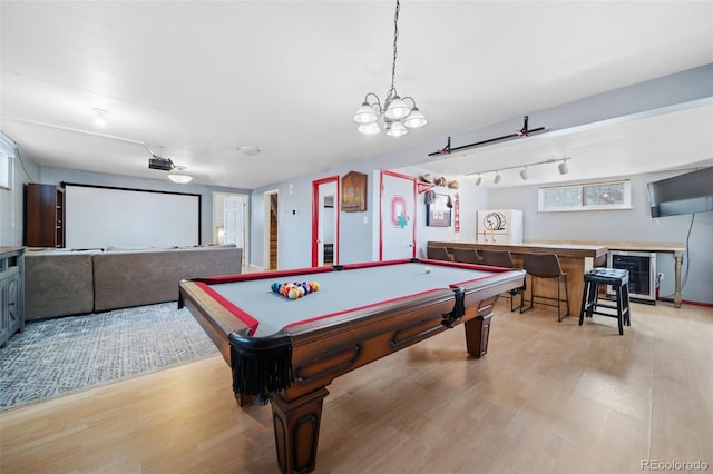 playroom featuring indoor bar, track lighting, billiards, and light wood-type flooring