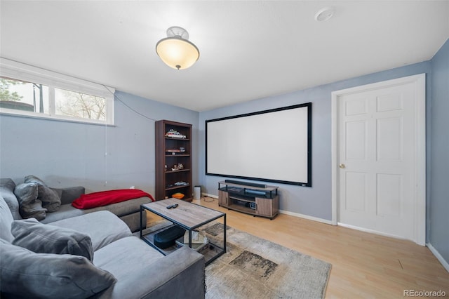 home theater room featuring light hardwood / wood-style flooring