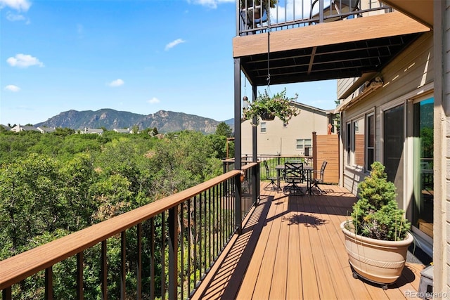 2854 Tenderfoot Hill St, Colorado Springs, CO 80906 - wooden terrace featuring outdoor dining space and a mountain view