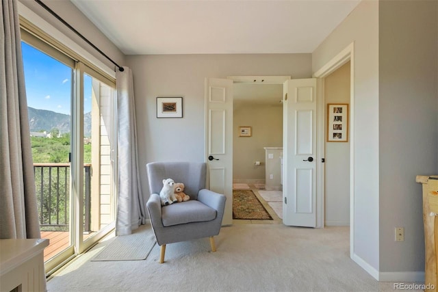 2854 Tenderfoot Hill St, Colorado Springs, CO 80906 - sitting room featuring a mountain view, a wealth of natural light, light carpet, and baseboards