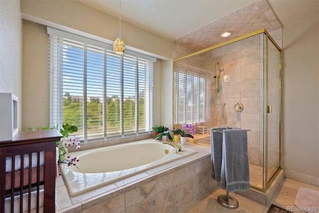 2854 Tenderfoot Hill St, Colorado Springs, CO 80906 - bathroom with a garden tub, a stall shower, and a healthy amount of sunlight