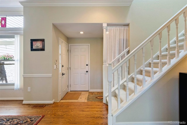 2854 Tenderfoot Hill St, Colorado Springs, CO 80906 - foyer featuring a wealth of natural light, crown molding, and wood finished floors