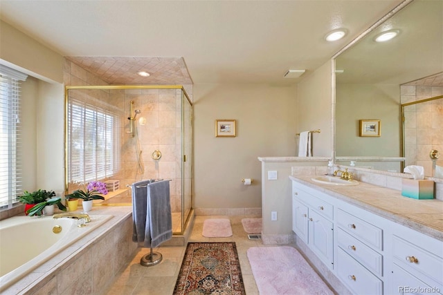2854 Tenderfoot Hill St, Colorado Springs, CO 80906 - full bath featuring a bath, vanity, a stall shower, and tile patterned flooring