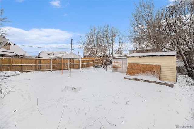 view of yard covered in snow