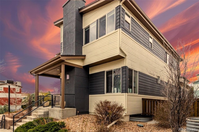 9791 Dunning Cir, Highlands Ranch, CO 80126 - view of side of home with a chimney