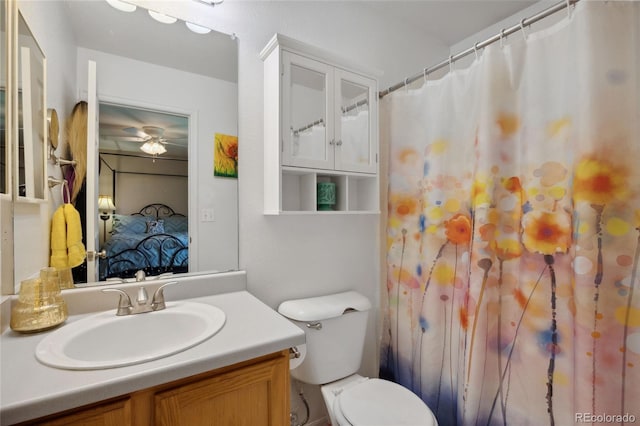 full bathroom with ensuite bath, ceiling fan, toilet, and vanity