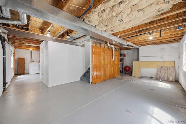 unfinished below grade area with washer / clothes dryer and stairway