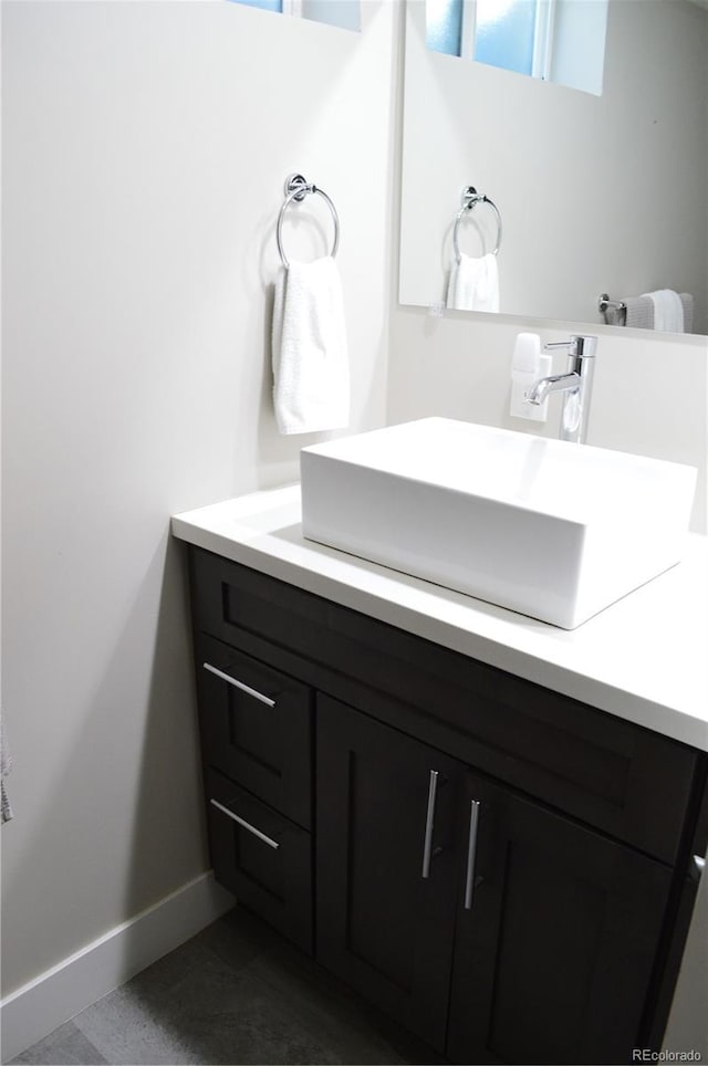2200 S Cherry St Unit 2216, Denver, CO 80222 - bathroom featuring vanity and baseboards