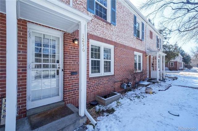 view of snow covered property