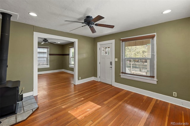 702 E Platte Ave, Colorado Springs, CO 80903 - entryway featuring a wood stove, baseboards, hardwood / wood-style flooring, ceiling fan, and recessed lighting