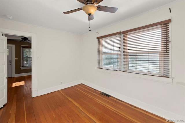 702 E Platte Ave, Colorado Springs, CO 80903 - unfurnished room featuring ceiling fan, hardwood / wood-style flooring, crown molding, baseboards, and a smoke detector