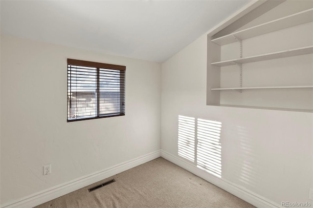702 E Platte Ave, Colorado Springs, CO 80903 - empty room with carpet flooring, baseboards, and lofted ceiling