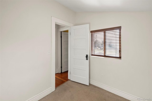 702 E Platte Ave, Colorado Springs, CO 80903 - spare room featuring light colored carpet and baseboards