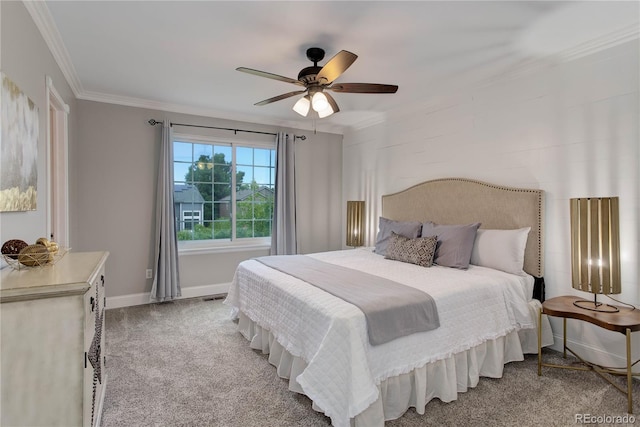 bedroom with ornamental molding, carpet, and ceiling fan