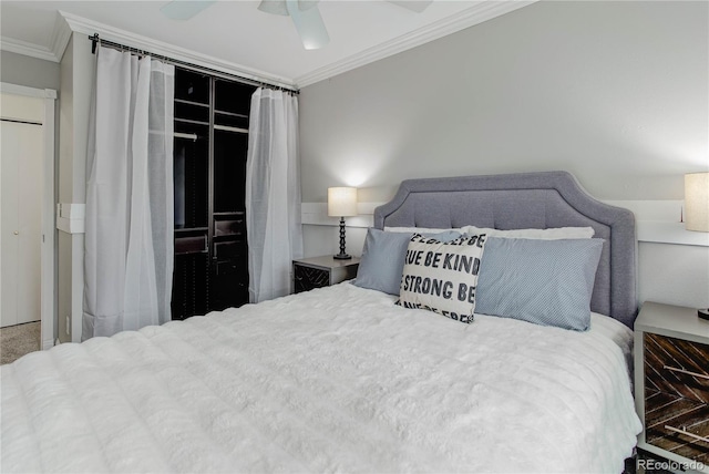 bedroom with ornamental molding, a closet, and ceiling fan