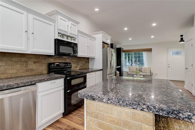 kitchen featuring white cabinetry, crown molding, black appliances, and light wood-type flooring