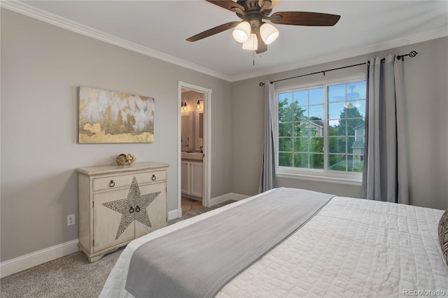 bedroom featuring ensuite bath, crown molding, light colored carpet, and ceiling fan