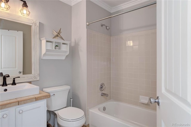 full bathroom with toilet, ornamental molding, tiled shower / bath combo, and vanity