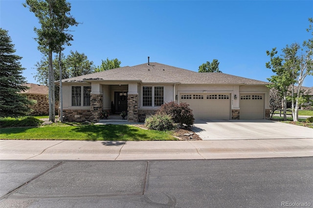 11422 W Cooper Ave, Littleton, CO 80127 - view of front of property featuring stone siding, an attached garage, stucco siding, and driveway