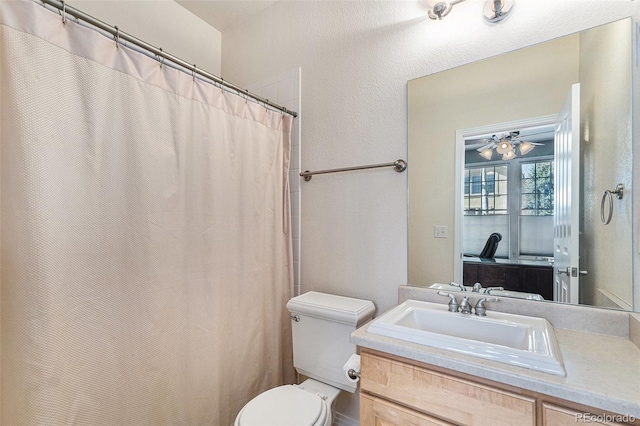 11422 W Cooper Ave, Littleton, CO 80127 - full bathroom with toilet and vanity