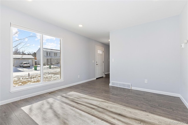 empty room with wood-type flooring