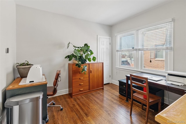 office area with baseboards and wood finished floors