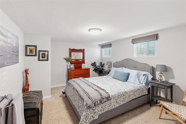 carpeted bedroom featuring baseboards