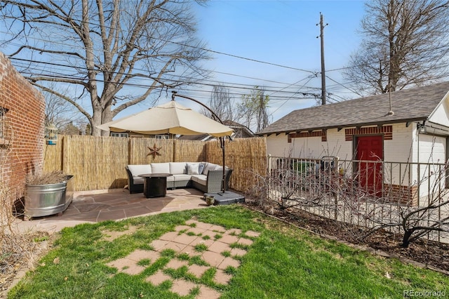view of yard featuring outdoor lounge area, a patio area, and a fenced backyard