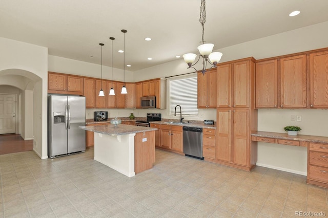 297 N Coolidge Way, Aurora, CO 80018 - kitchen with stainless steel appliances, a sink, arched walkways, a chandelier, and light stone counters