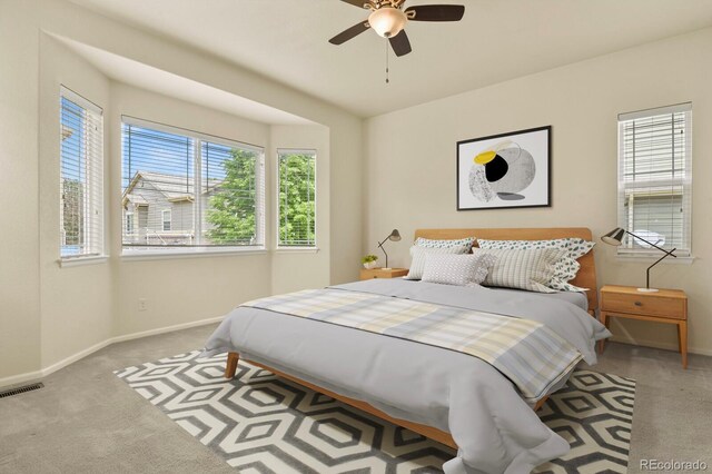 297 N Coolidge Way, Aurora, CO 80018 - carpeted bedroom featuring baseboards and ceiling fan